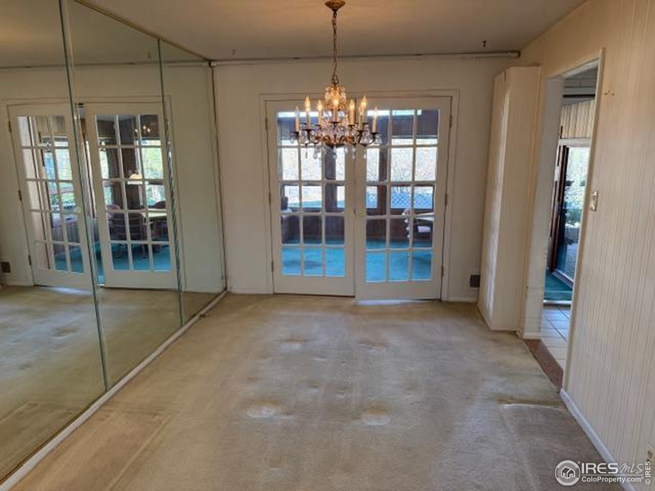 10357 Monterey Circle Northglenn, CO 80260 - Photo 11 of 18 a view of an empty room with glass door and windows