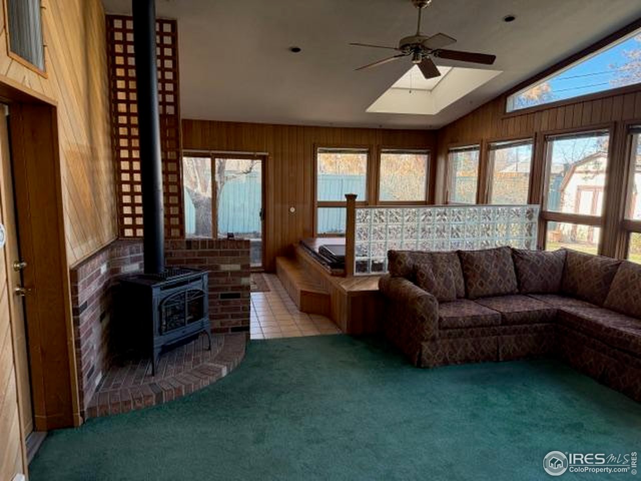 10357 Monterey Circle Northglenn, CO 80260 - Photo 7 of 18 a living room with furniture and a fireplace