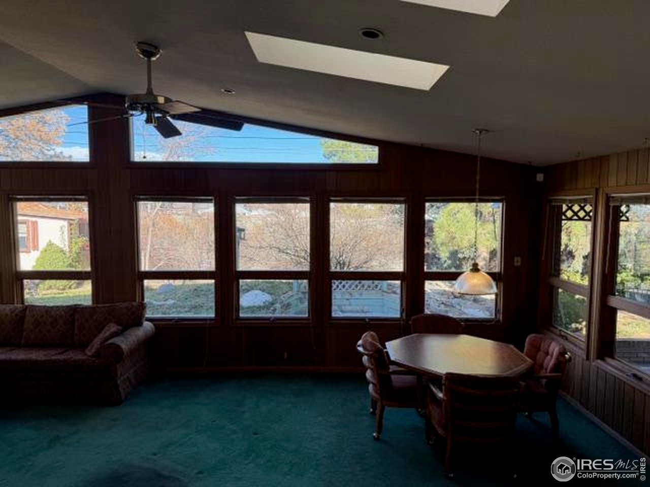 10357 Monterey Circle Northglenn, CO 80260 - Photo 9 of 18 a living room with furniture and a window