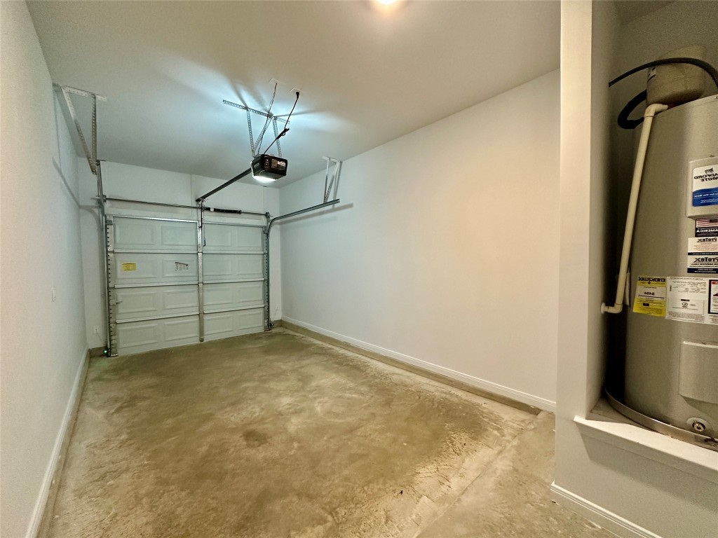 2913 Quail Rdg Lane, Unit B Temple, TX 76501 - Photo 19 of 20 Garage with water heater and a garage door opener