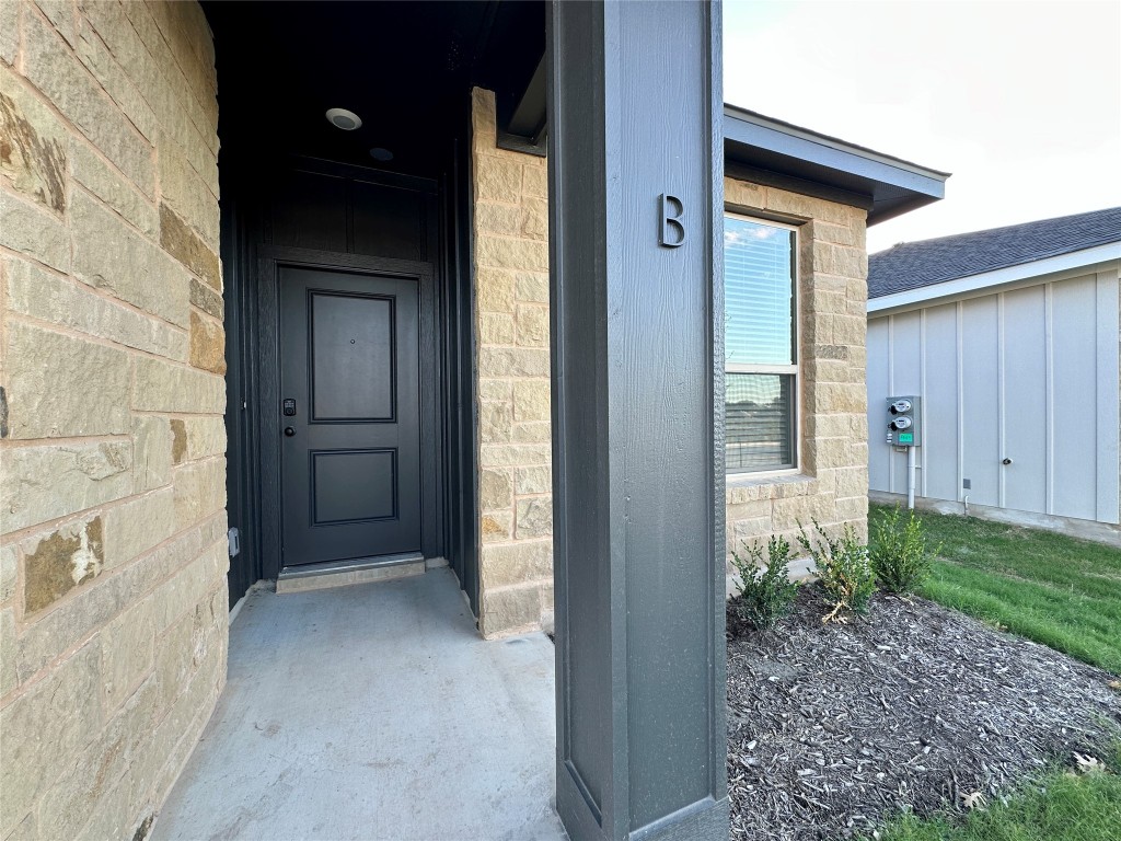 2913 Quail Rdg Lane, Unit B Temple, TX 76501 - Photo 3 of 20 Property entrance featuring stone siding