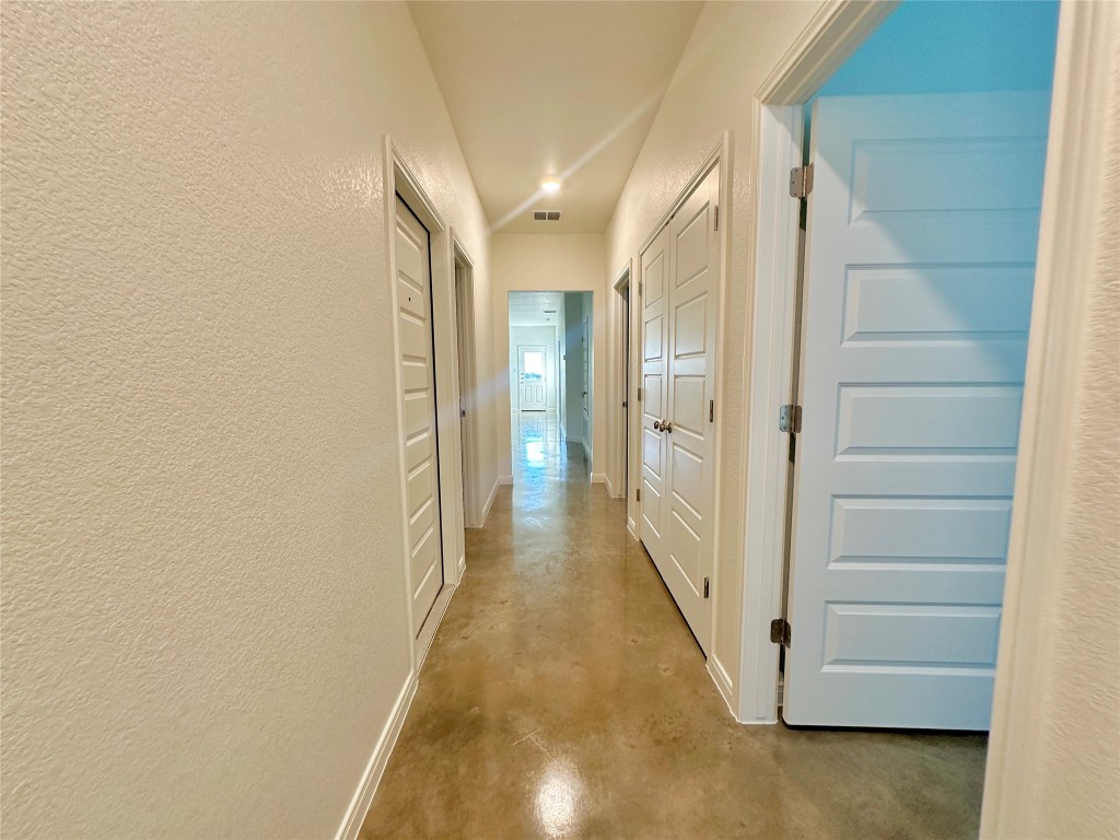 2913 Quail Rdg Lane, Unit B Temple, TX 76501 - Photo 5 of 20 Hall featuring finished concrete flooring and a textured wall