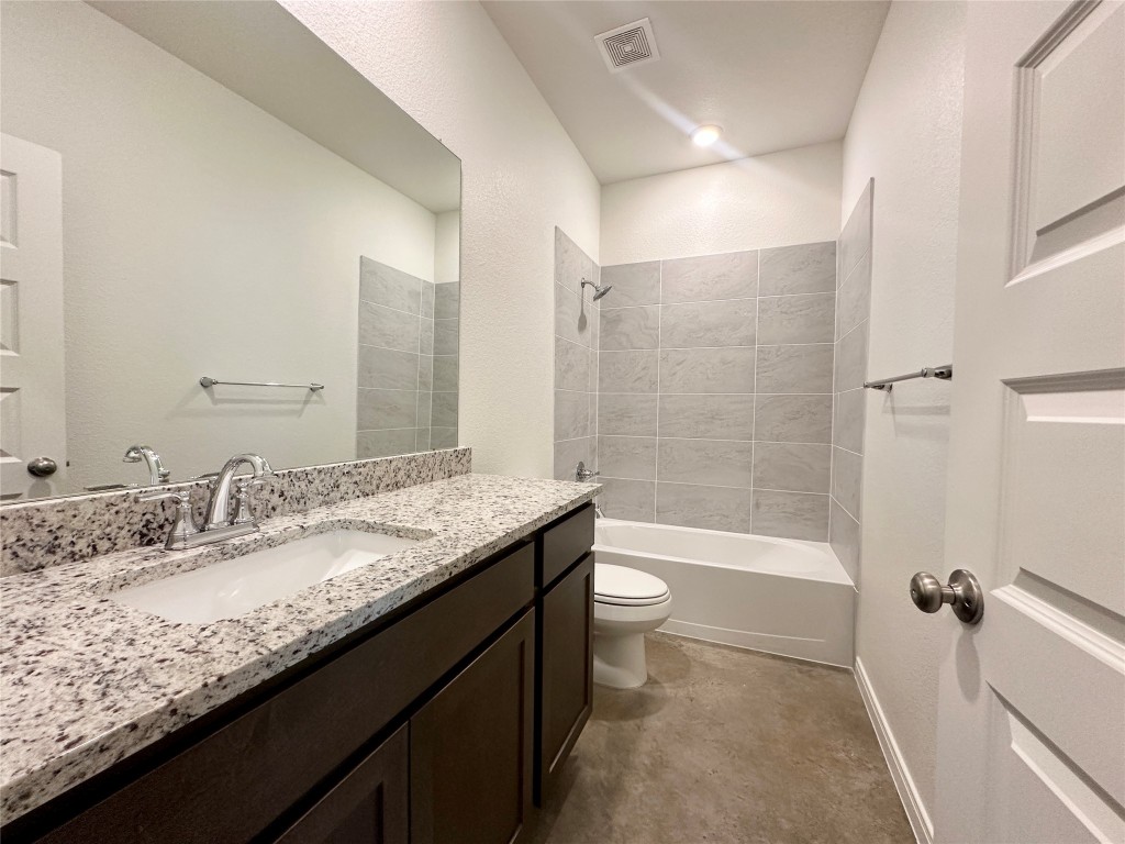 2913 Quail Rdg Lane, Unit B Temple, TX 76501 - Photo 7 of 20 Secondary full bath featuring shower / washtub combination, vanity, and a textured wall