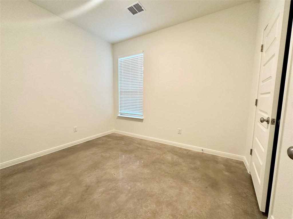 2913 Quail Rdg Lane, Unit B Temple, TX 76501 - Photo 8 of 20 Bedroom 2 featuring concrete floors and baseboards