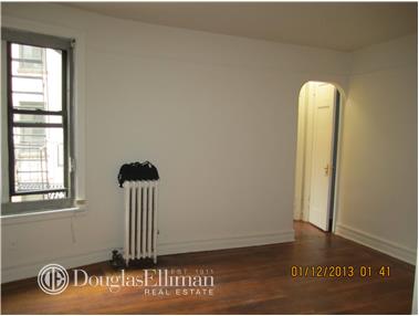 a view of a door and chair in a room