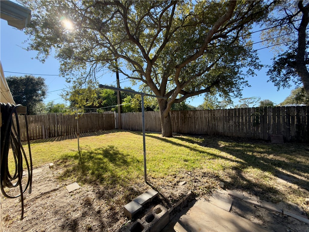 4006 Easy Street Corpus Christi, TX 78418 - Photo 7 of 8 a view of a backyard with wooden fence