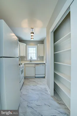 a view of cabinets and a kitchen