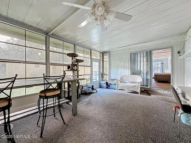 a bedroom with furniture and a window