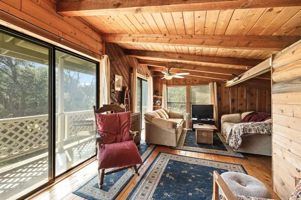 a bed room with a bed and a large window