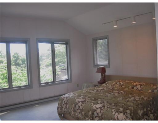 2630 Post Road South Kingstown, RI 02879 - Photo 12 of 20 Master Bedroom. The master bedroom is a suite with a generous south facing bedroom, a large, two door walk-in closet, a cedar closet, separate mirrored vanity room with basin and a wonderful red and black bathroom with a stall shower and whirlpool bath.
