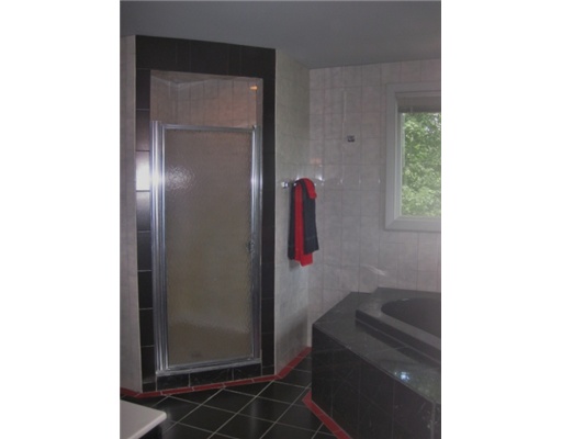 2630 Post Road South Kingstown, RI 02879 - Photo 13 of 20 Master Bath/Spa. Red, black and white tiled bath with vanity, closet, stall shower and spa.