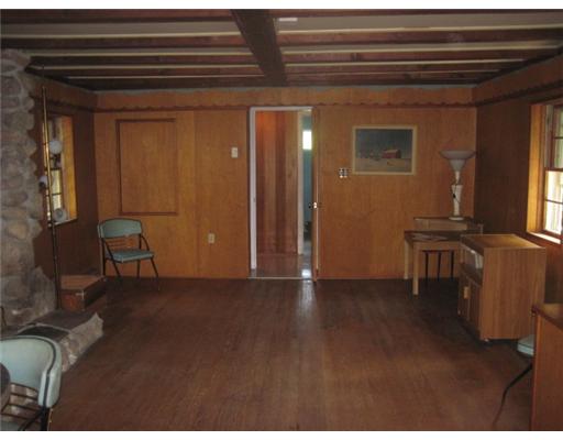 2630 Post Road South Kingstown, RI 02879 - Photo 16 of 20 Den/Family/Great Room. The family room features a massive stone fireplace and a kitchenette and a bar that swings out of the wall.