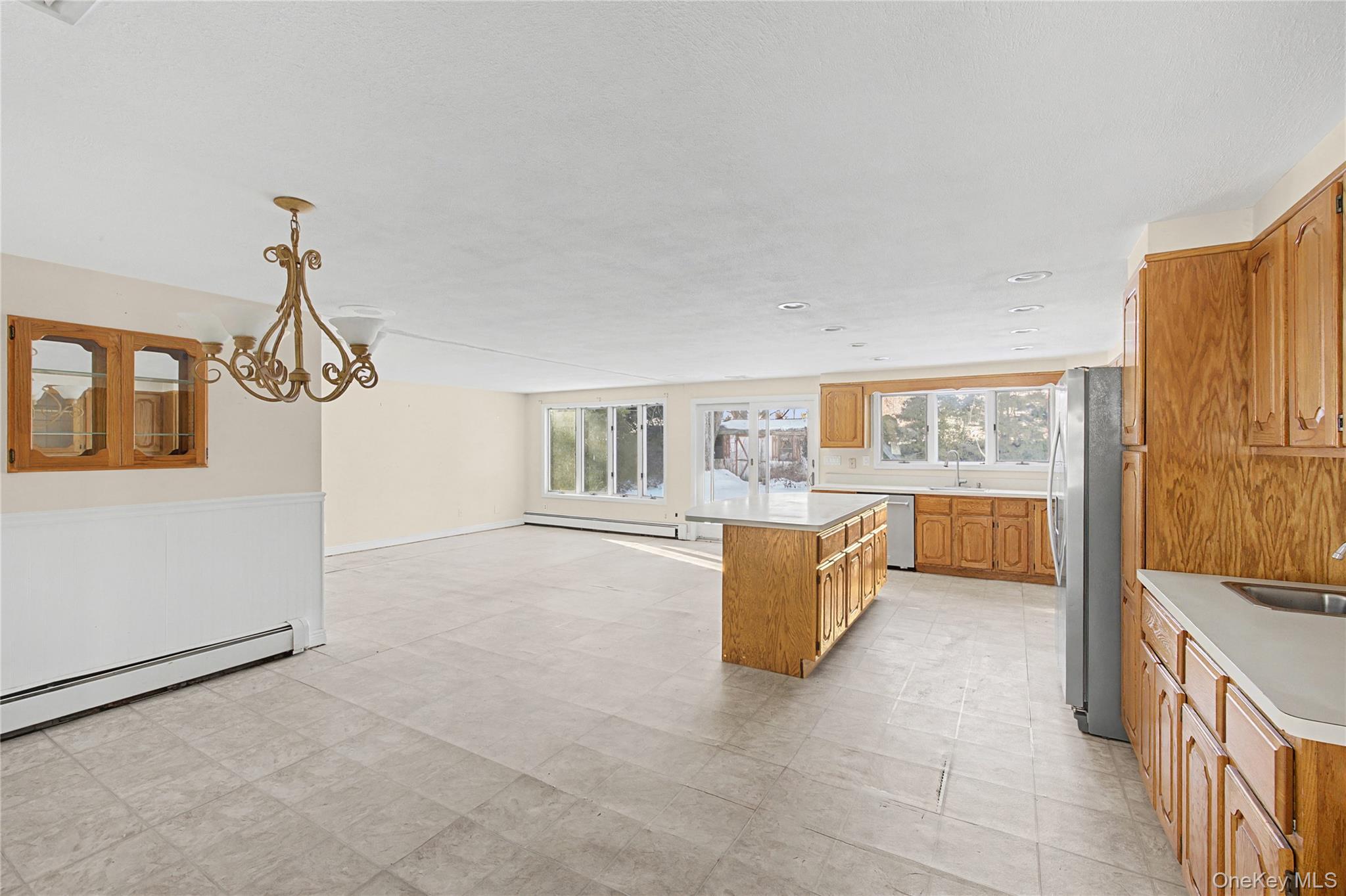 18 Woodbrook Drive Ridge, NY 11961 - Photo 12 of 33 a view of living room kitchen with furniture and wooden floor