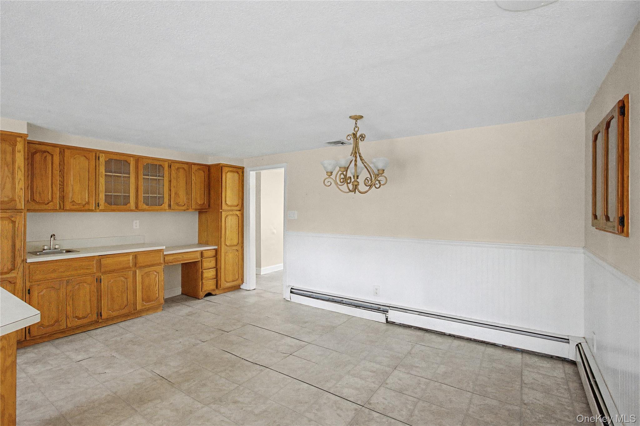 18 Woodbrook Drive Ridge, NY 11961 - Photo 15 of 33 a view of a kitchen with a sink