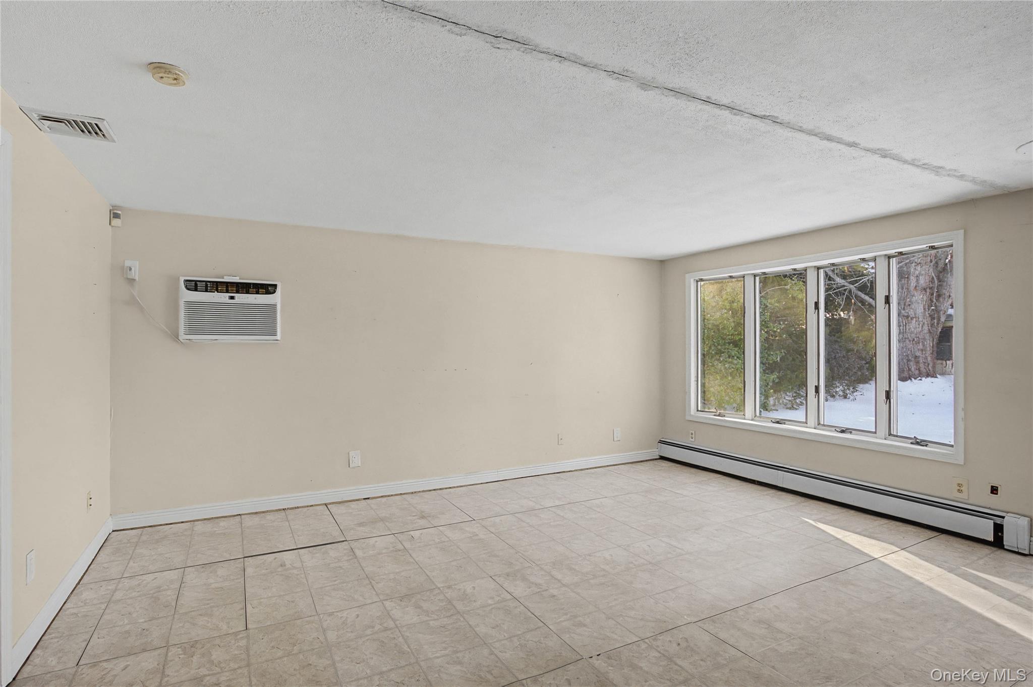 18 Woodbrook Drive Ridge, NY 11961 - Photo 20 of 33 a view of an empty room with a window