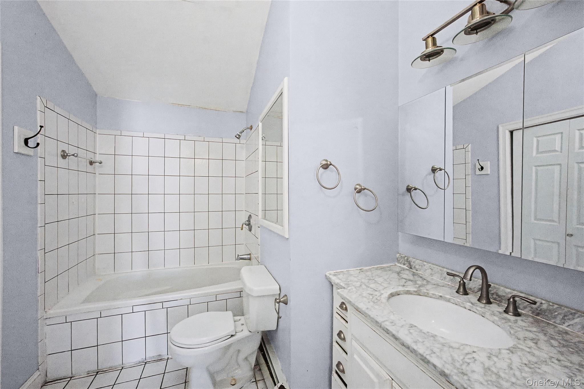 18 Woodbrook Drive Ridge, NY 11961 - Photo 23 of 33 a bathroom with a granite countertop bathtub shower sink mirror and toilet