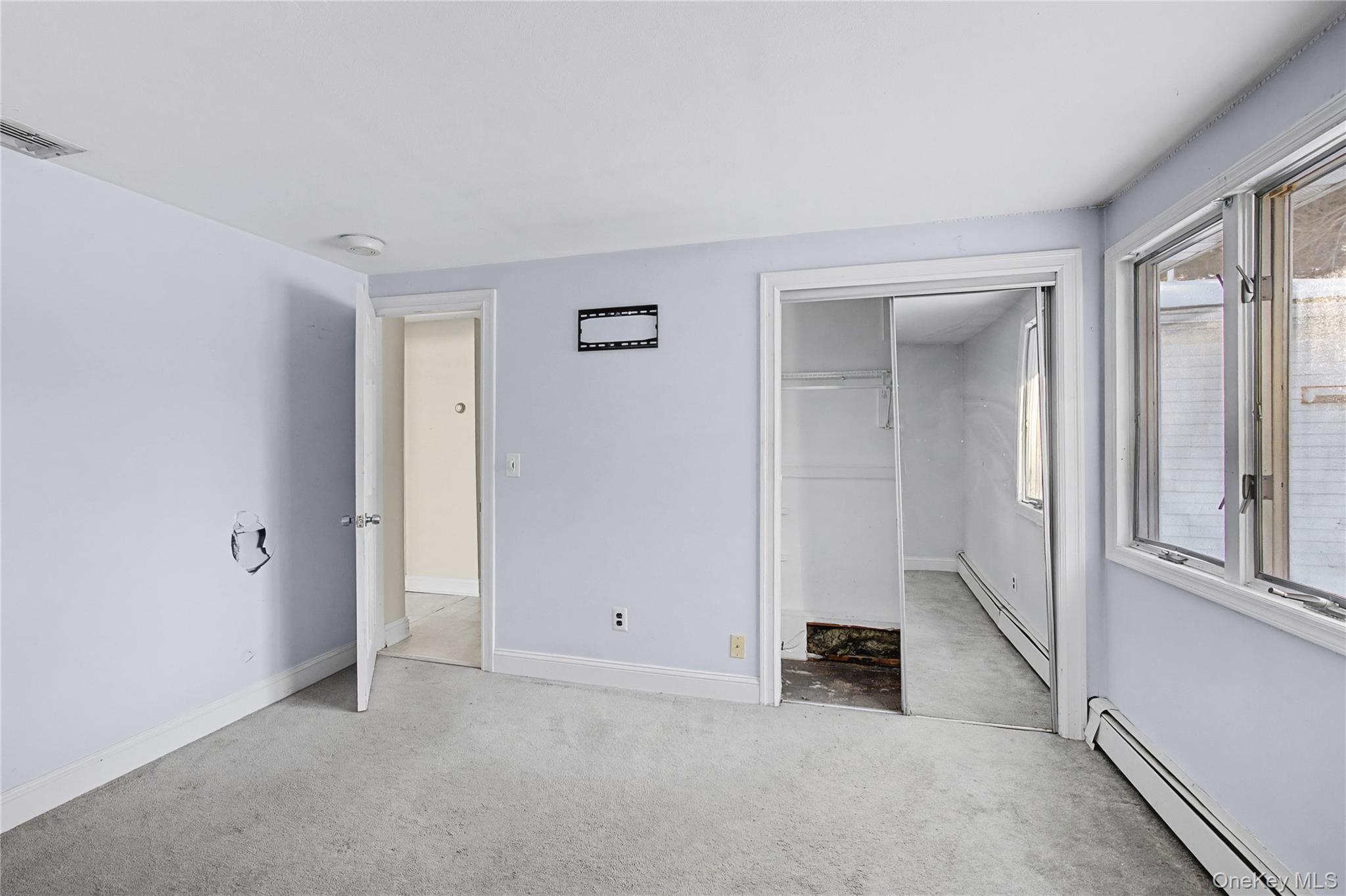 18 Woodbrook Drive Ridge, NY 11961 - Photo 26 of 33 an empty room with windows