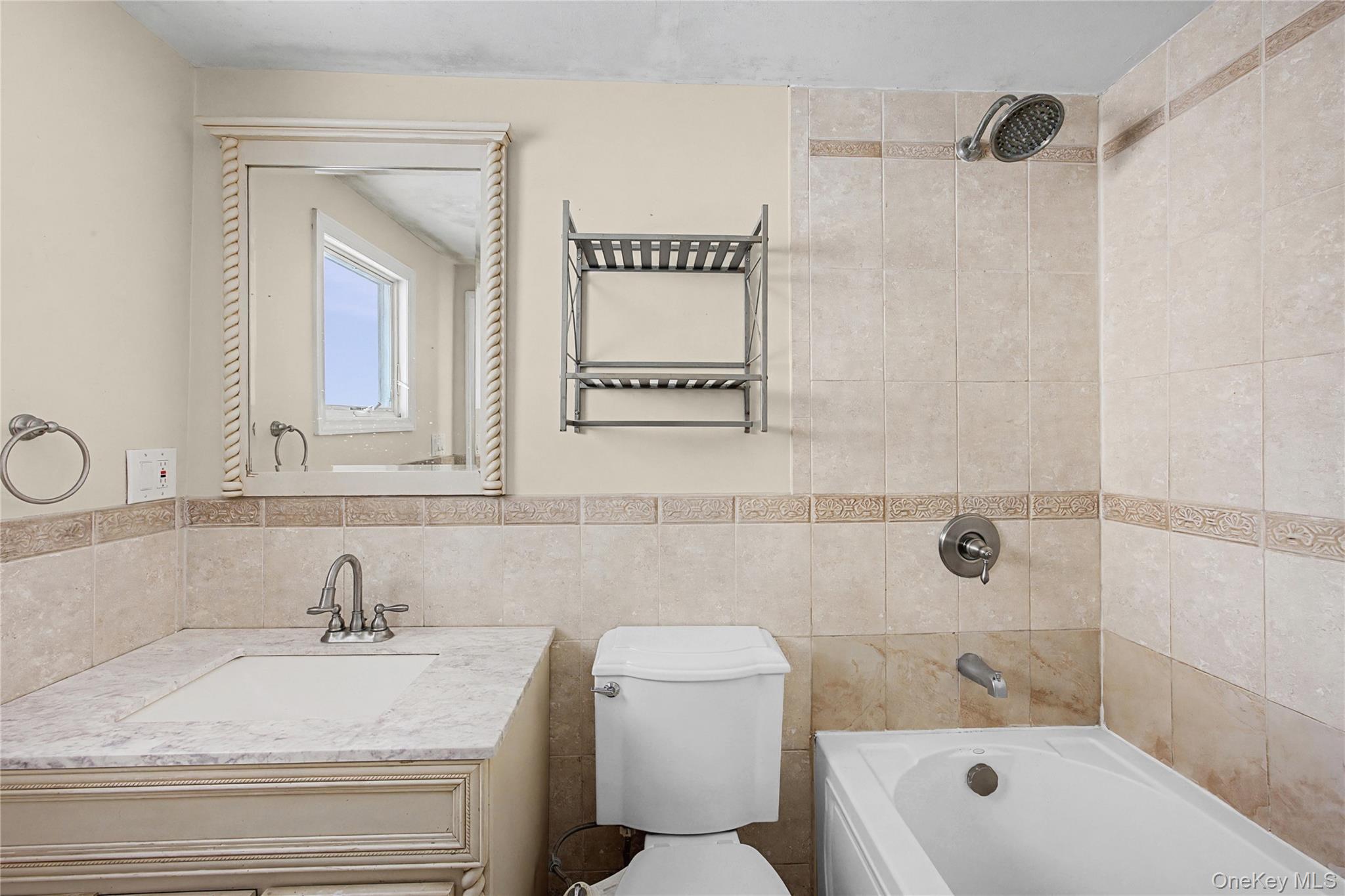 18 Woodbrook Drive Ridge, NY 11961 - Photo 31 of 33 a bathroom with a sink a toilet and shower