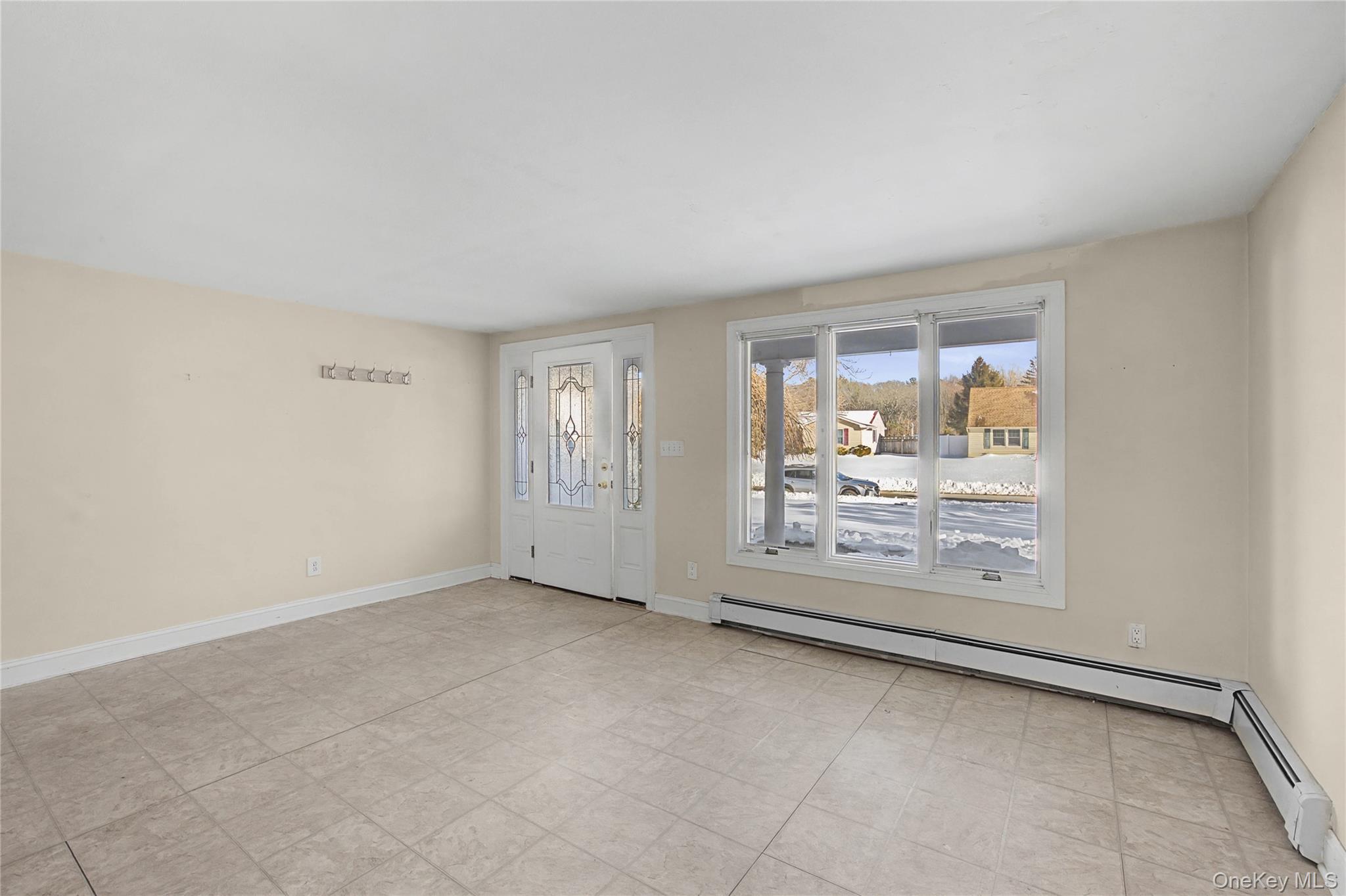 18 Woodbrook Drive Ridge, NY 11961 - Photo 7 of 33 an empty room with windows