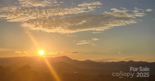 a view of an ocean and a mountain