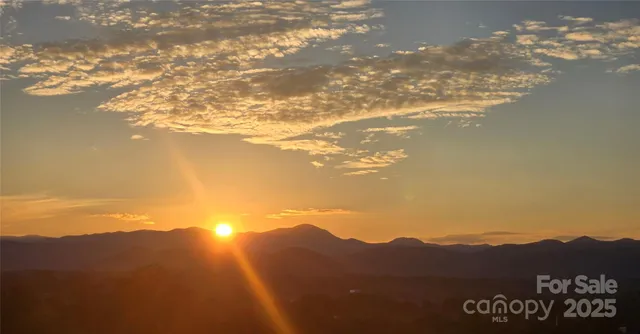 a view of an ocean and a mountain