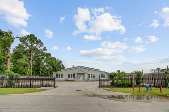 a front view of a house with a garden and plants