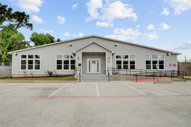 a view of a house with pool and chairs