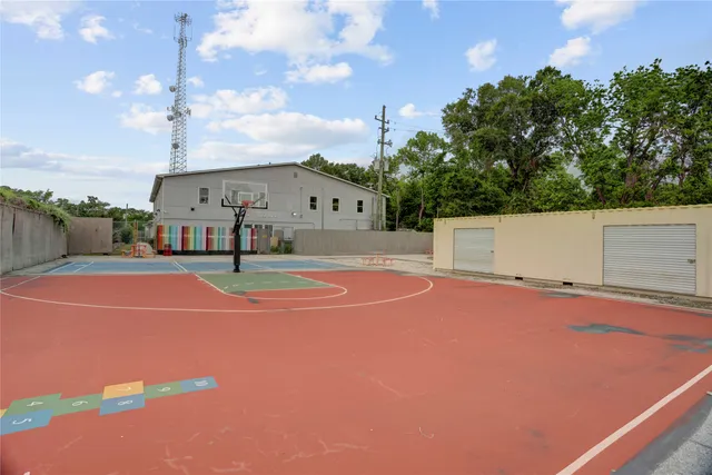 a view of a white house with a swimming pool