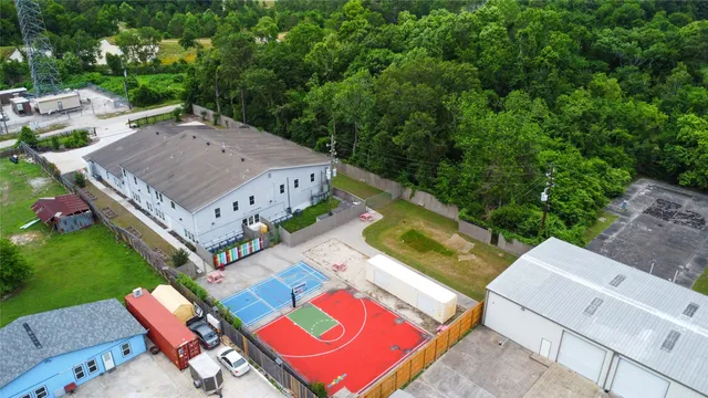 an aerial view of a house with yard swimming pool and outdoor seating