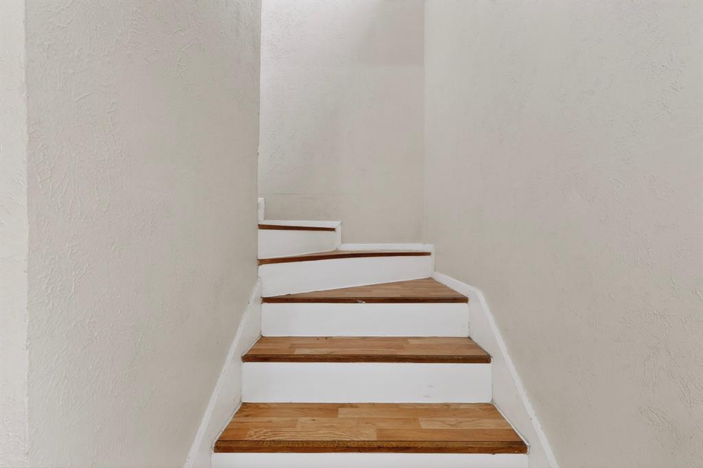 703 East Shady Grove Road Irving, TX 75060 - Photo 19 of 40 a view of staircase with white walls