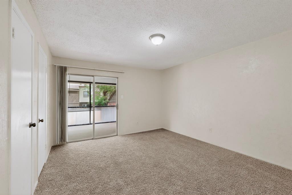 703 East Shady Grove Road Irving, TX 75060 - Photo 21 of 40 an empty room with windows
