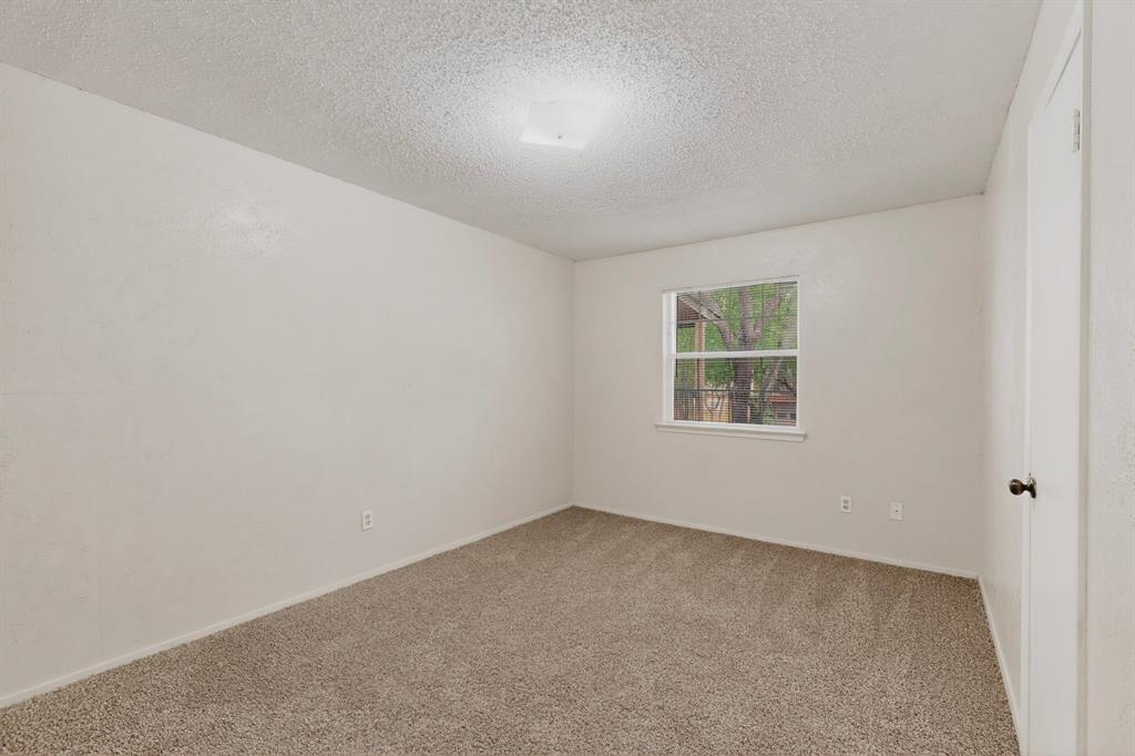 703 East Shady Grove Road Irving, TX 75060 - Photo 33 of 40 an empty room with windows
