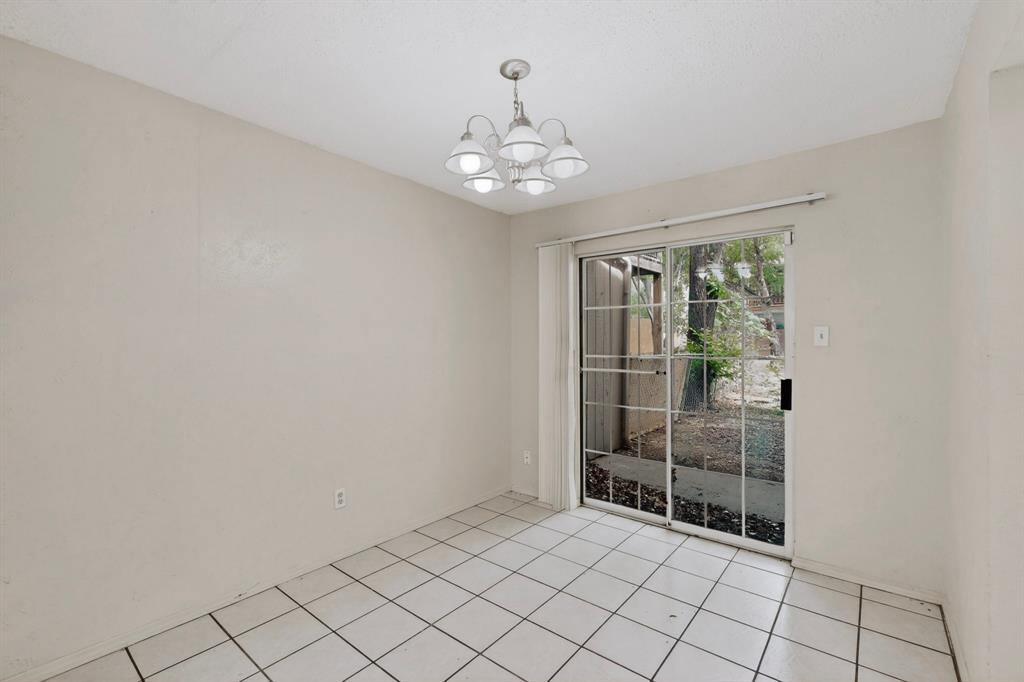 703 East Shady Grove Road Irving, TX 75060 - Photo 8 of 40 a view of an empty room with window