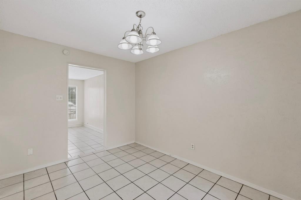 703 East Shady Grove Road Irving, TX 75060 - Photo 9 of 40 wooden floor in an empty room