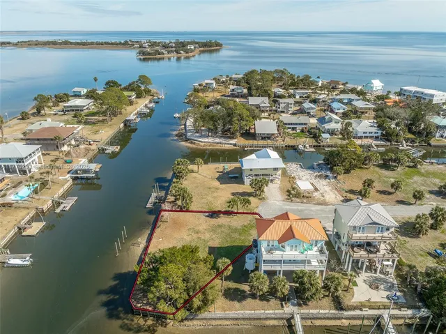 an aerial view of a house with a lake view
