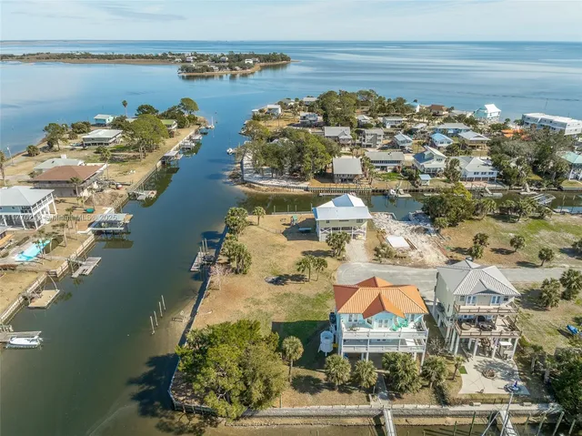 an aerial view of a house with a lake view