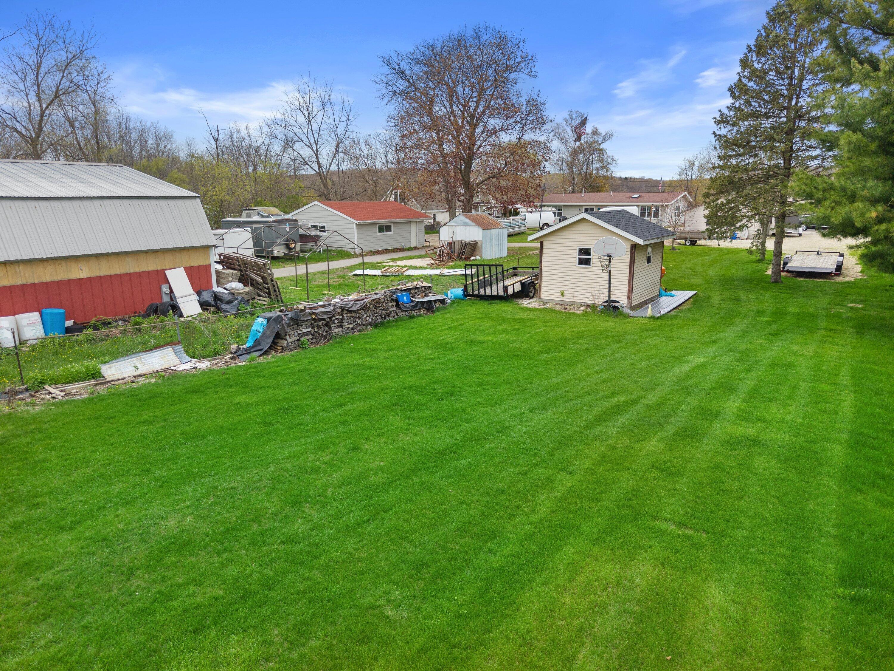 N95-w26705 County Rd Q Hartland, WI 53029 - Photo 34 of 55 DJI_20260430150528_0476_D