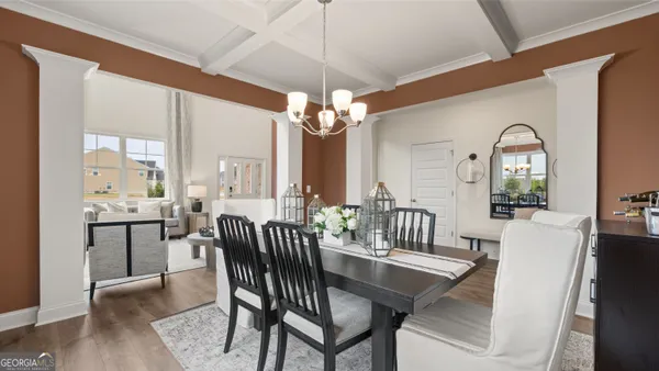 a kitchen with granite countertop white cabinets and black appliances