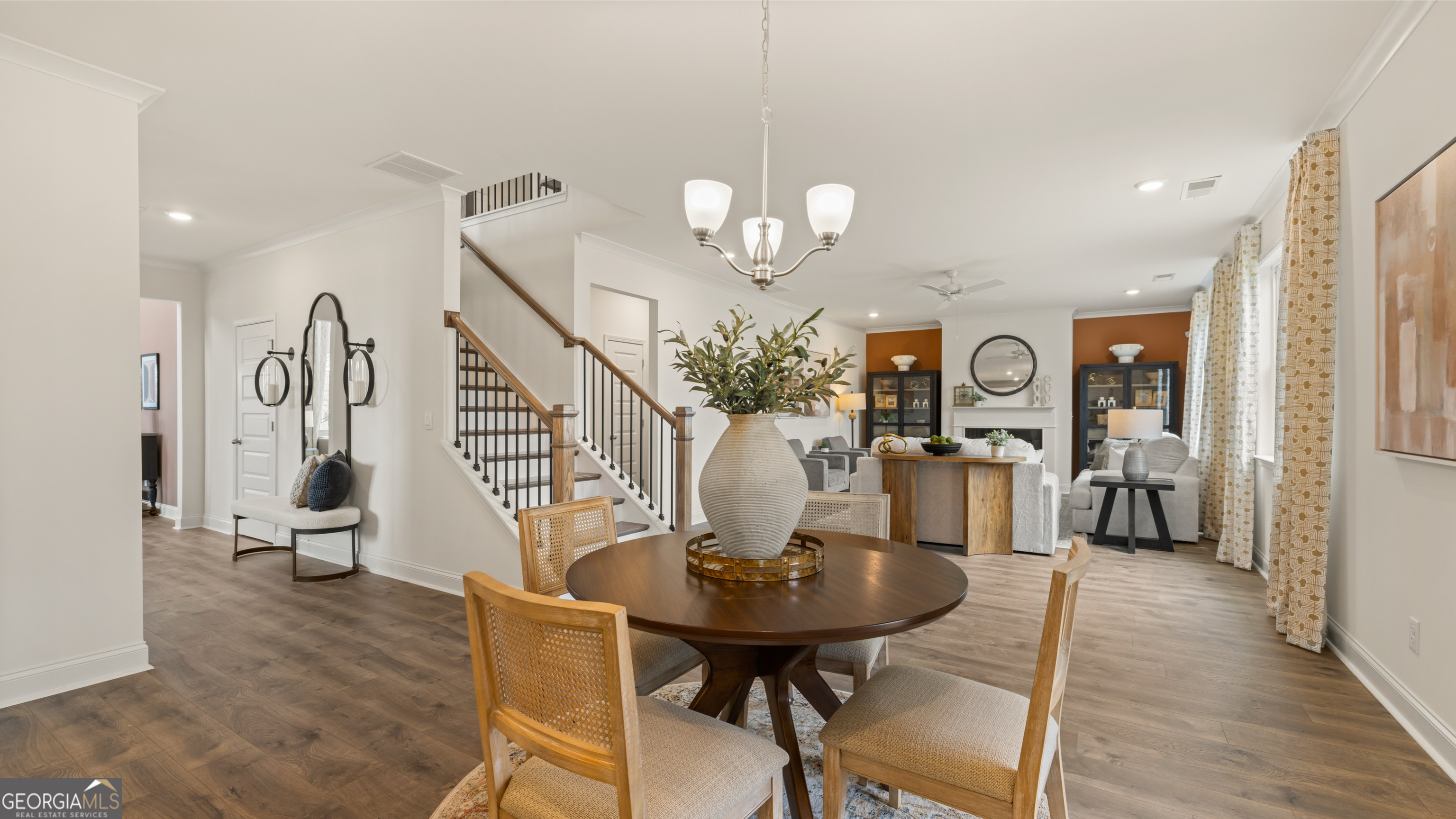 1624 Bernard Court Hampton, GA 30228 - Photo 24 of 75 a view of a dining room with furniture and wooden floor