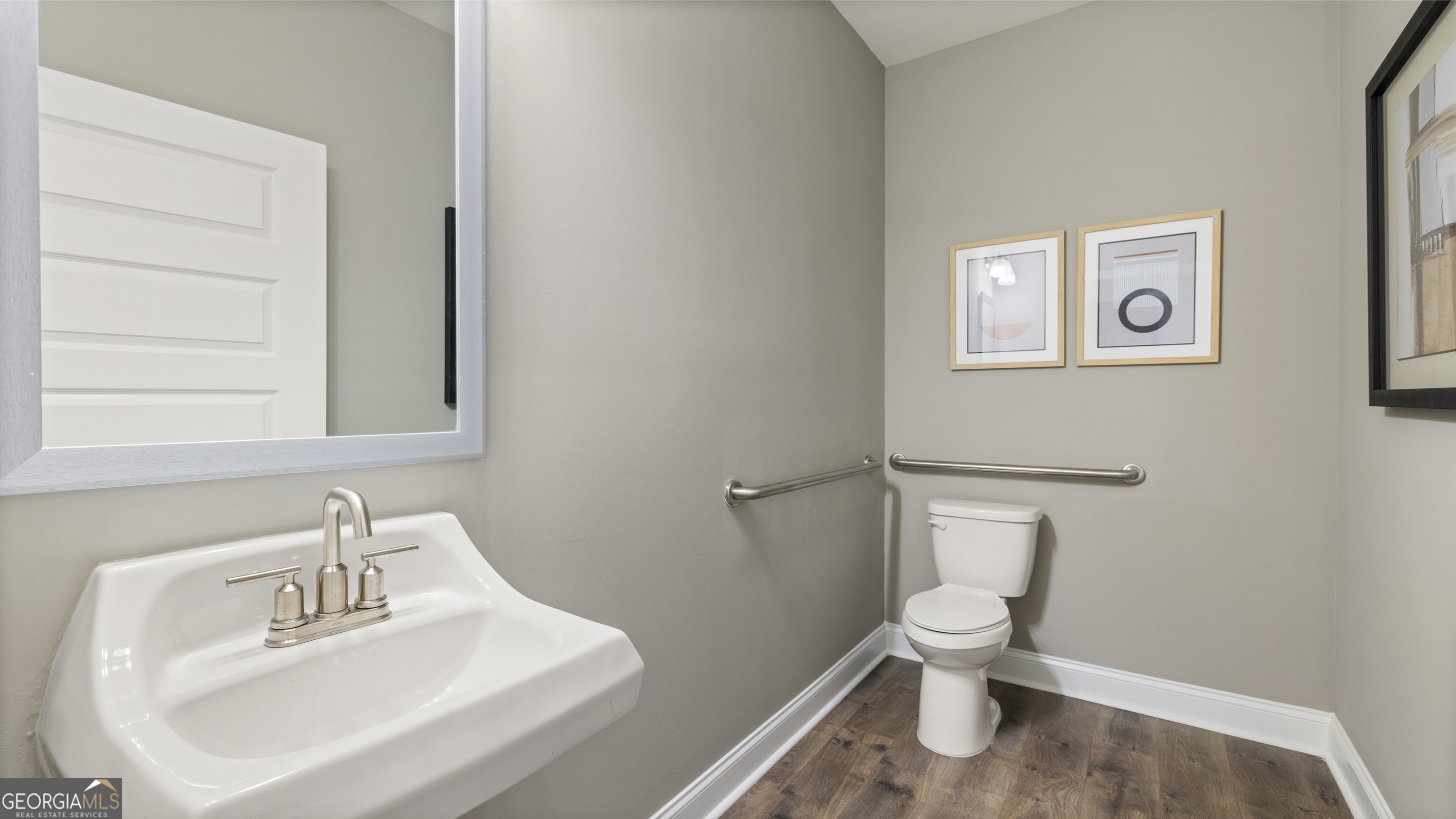 1624 Bernard Court Hampton, GA 30228 - Photo 38 of 75 a white toilet sitting next to a bathroom sink