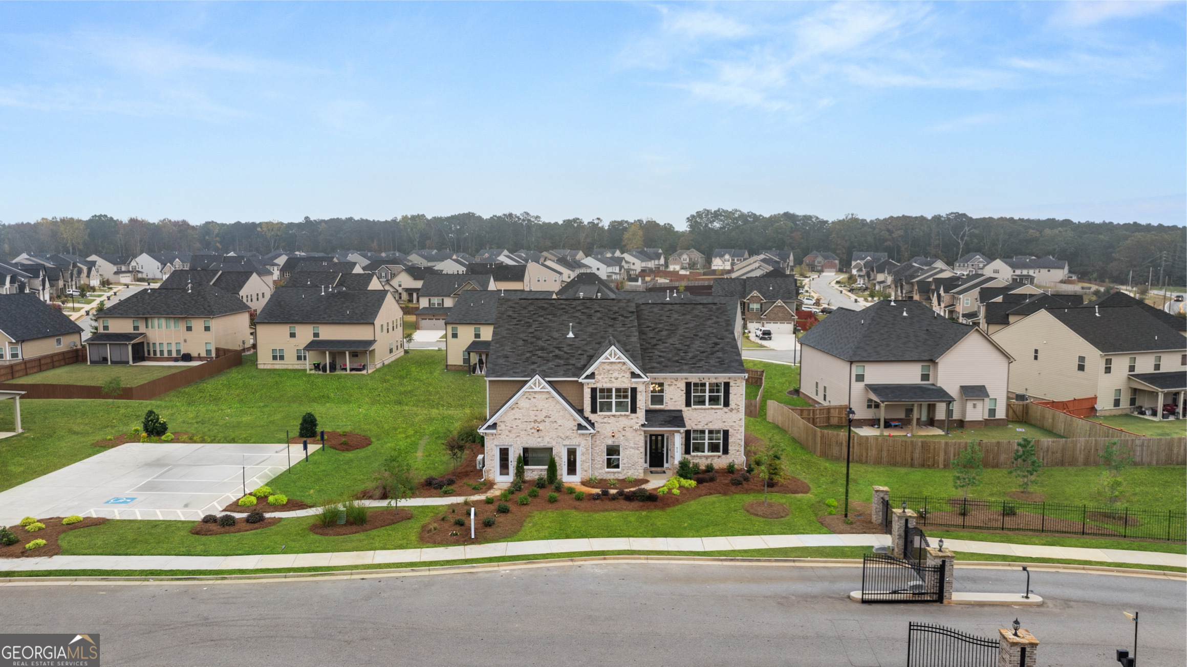 1624 Bernard Court Hampton, GA 30228 - Photo 4 of 75 an aerial view of a house with a garden and lake view