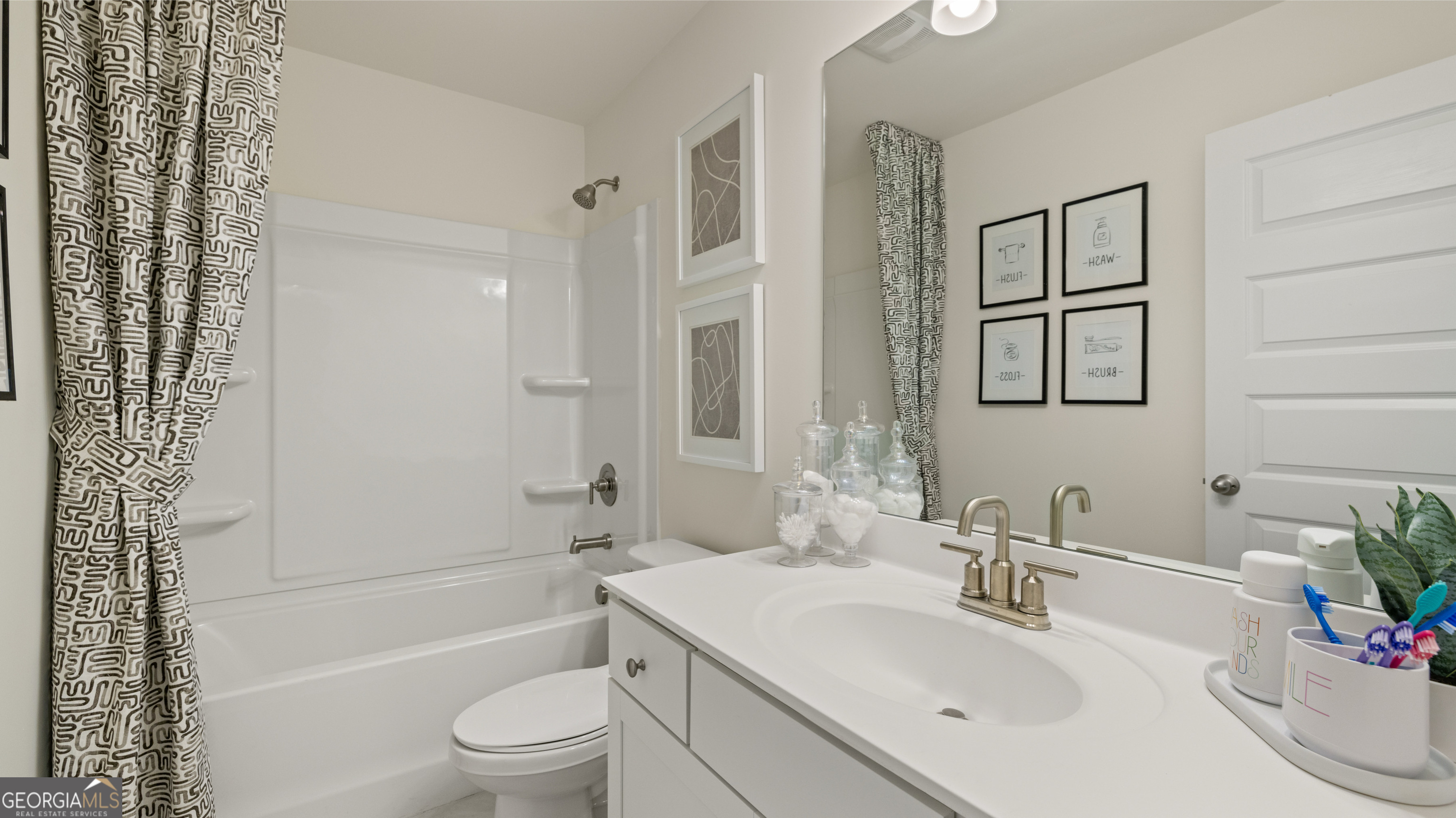 1624 Bernard Court Hampton, GA 30228 - Photo 69 of 75 a bathroom with a sink a toilet and shower