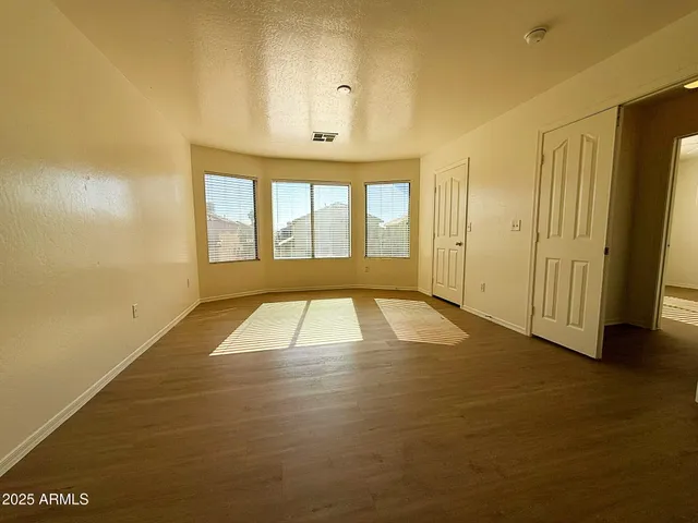 a view of empty room with windows