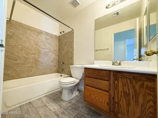 a bathroom with a sink a toilet and a bathtub