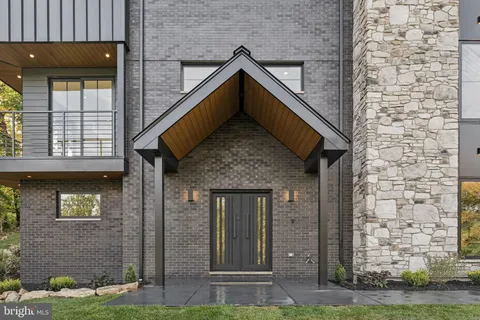 a bathroom with a shower and a glass door
