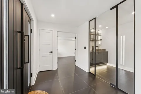 a view of staircase with white walls and a window