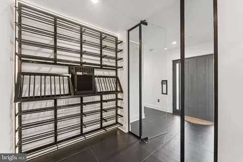 a kitchen with stainless steel appliances kitchen island granite countertop a refrigerator and a sink