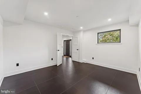 a large kitchen with kitchen island granite countertop a large counter top stainless steel appliances and cabinets