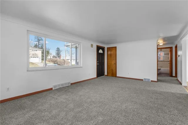 a view of empty room with windows