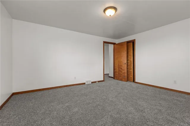 an empty room with a empty space and a window